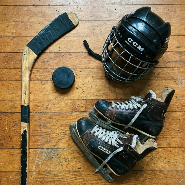 Hockey equipment including stick, helmet, skates, and puck